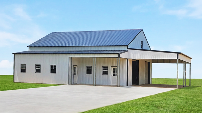 Classic country style barndominium with traditional metal roof
