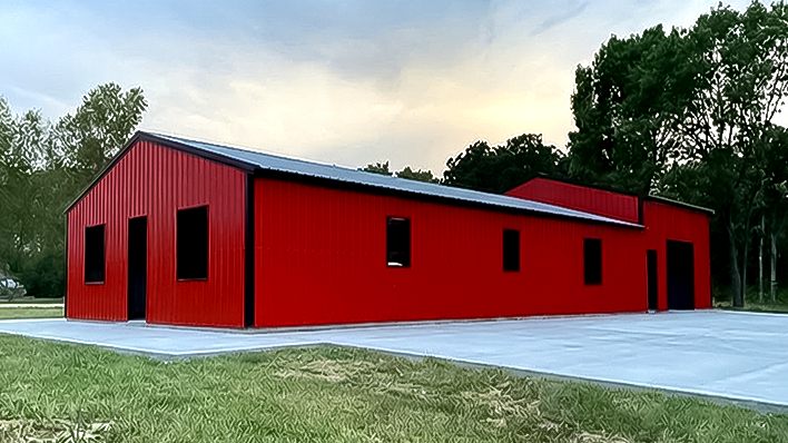 Red steel barndominium with full living quarters and workshop